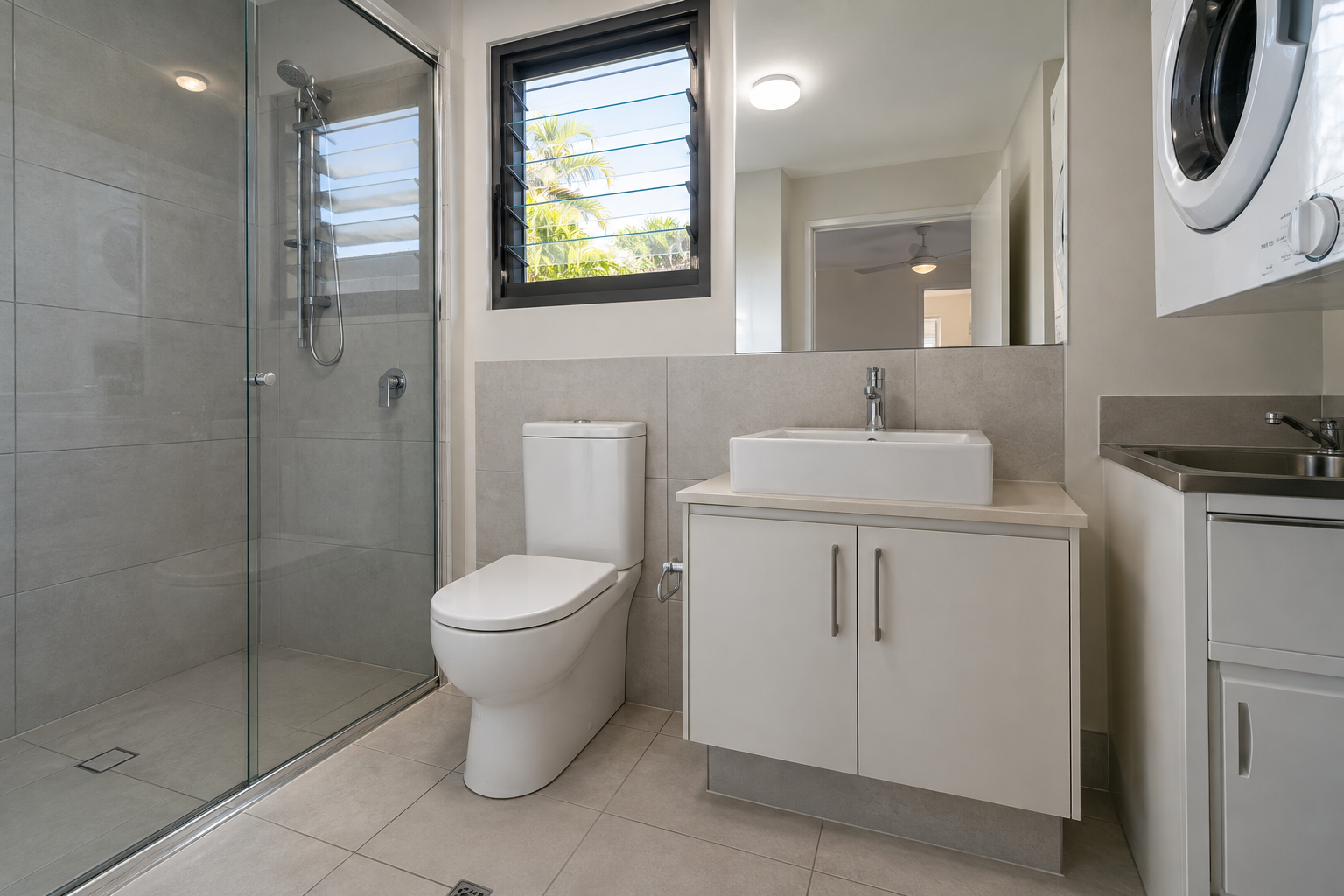 Spotless apartment bathroom and laundry area after a bond clean